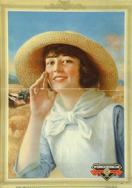 Advertising calendar for McCormick-Deering farm products. Features an image of a woman in a straw hat and kerchief with a Mogul tractor and McCormick binder in the background.
