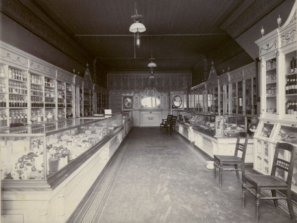 Interior view of the John Dadd and Son Pharmacy. John Dadd was the first President of the Wisconsin Pharmaceutical Association, and is considered one of the "grand old fathers" of Wisconsin pharmacy.