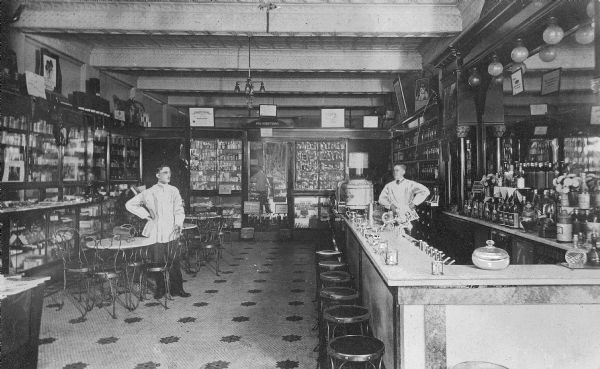 Employees stand near the soda fountain at the Cassidy Drugstore.