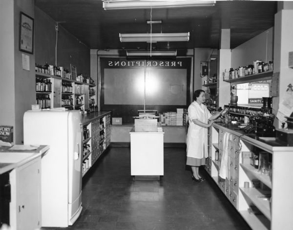 Pharmacist Joyce Smith Gaines examines a product in her laboratory.