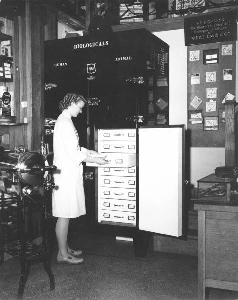 A clerk checks the status of the refrigerated stocks of various biological materials at the D.F. Jones Pharmacy.