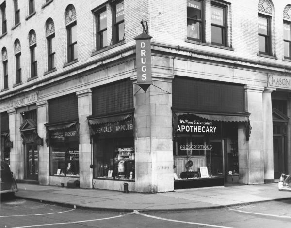 Exterior view of William E. Burckart's drug store. A traditional pharmaceutical show globe can be found in the window on the right side.