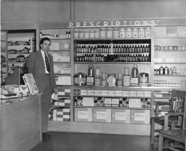 Eugene Phillips poses in his pharmacy's prescription department.