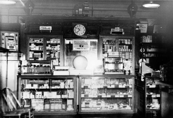View of glass display cabinets in Richard's Pharmacy.