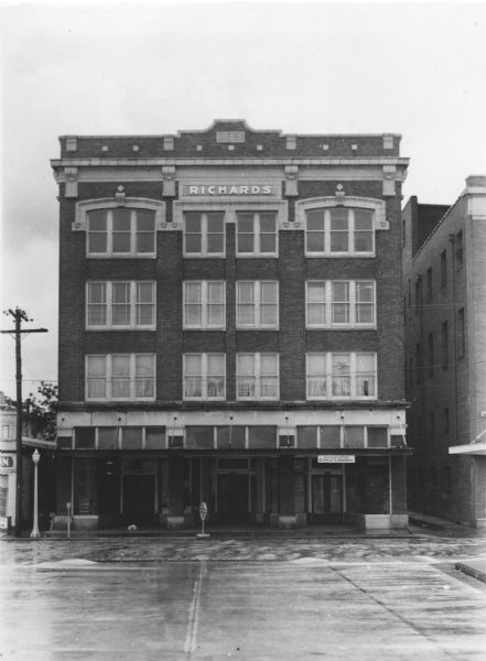 Exterior view of the brick building that houses Richards Brothers' Pharmacy.