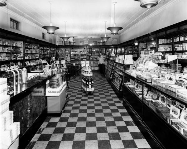 Interior view of Gerding's Pharmacy. The soda fountain area is on the left, while both the cigar and dental displays are on the right.
