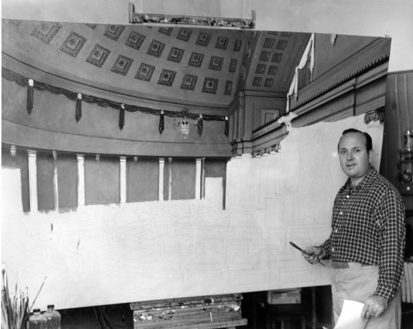 The artist Robert Thom pauses to pose with his new painting, "The Forming of the United States Pharmacopeia", which depicts the inaugural delegates to the Convention in 1820.