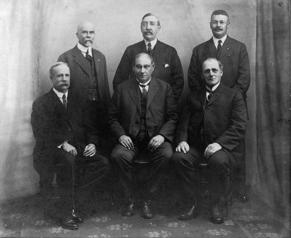 Members of the 1910-1920 United States Pharmacopeial Convention. Pictured are, seated: Joseph Remington, Harvey Wiley, and Murray Galt Motter. Seated: Henry Whelpley, Fred Meissner, and James Beal.