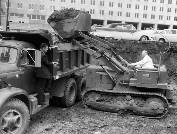 Robert Fischelis  and George Griffenhagen assist in the groundbreaking for an addition to the American Pharmaceutical Association headquarters.