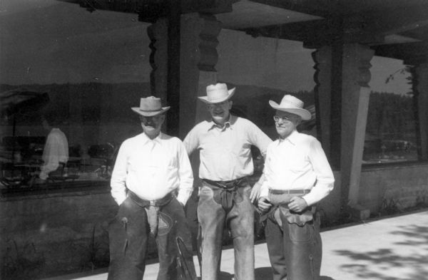 Three prominent pharmacists (L to R), B.R. Mull (Eli Lilly & Co.), Robert Fischelis (American Pharmaceutical Association), and Charles Lanwermeyer (Abbott Laboratory), dress in cowboys clothes during their off-time at the Idaho State Pharmaceutical Association Conference. The three were principal speakers at the event.