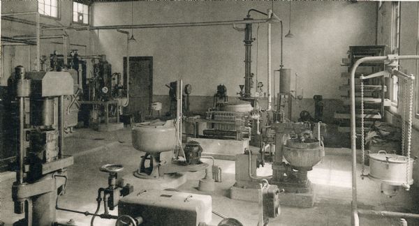 View of pharmaceutical processing equipment in one of the laboratory classrooms at Kyoto University's Pharmaceutical Sciences building.