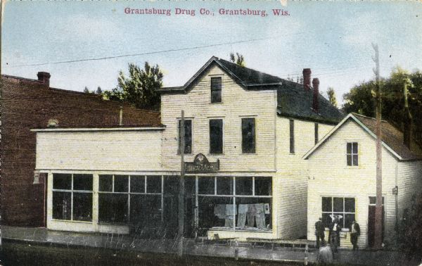 View of the Grantsburg Drug Company. Caption reads: "Grantsburg Drug Co., Grantsburg, Wis."