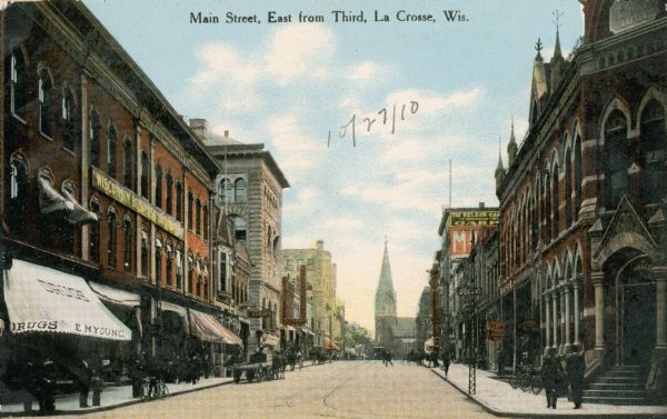 Main Street looking eastwards from Third Street. E.M. Young's Drugstore is in the lower left hand corner. Caption reads: "Main Street, East from Third, La Crosse, Wis."