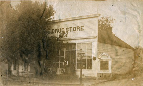 Exterior view of Staples' Drugstore, the first drugstore in Osceola. Druggist C.W. Staples was also a member of the local committee on equalization of taxes.