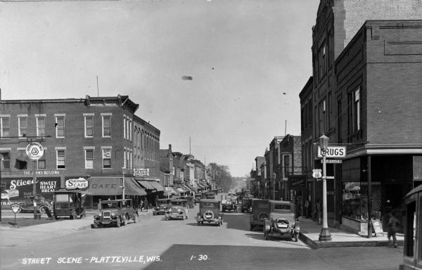 View looking east down Main Street at the intersection with Court Street. Coyle's Drugstore is on the right.
