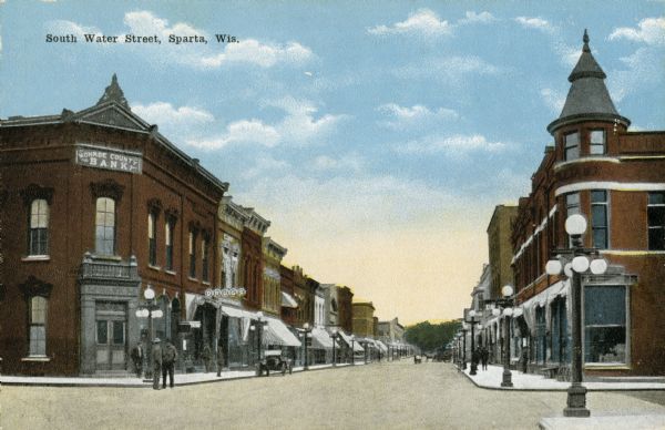 View of businesses on South Water Street, including the Monroe County Bank and a drugstore on the left. Caption reads: "South Water Street, Sparta, Wis."