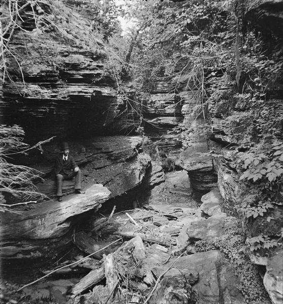 Taylor's Glen; Reportedly known as Schoolhouse Ravine. There is a man sitting on left on a ledge.
