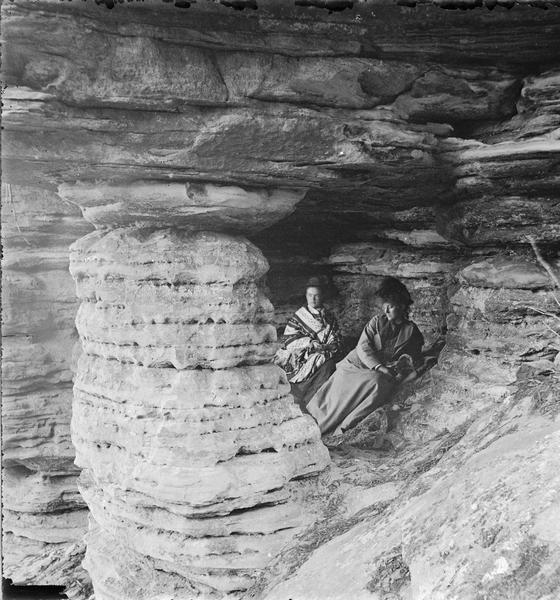 Cave Cozy, near the Hornet's Nest. Two women are sitting in the cave.