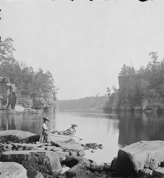 Lower Jaws, looking downstream through from Stone Pile. Two children are the at edge of the water, one in a boat, one standing.