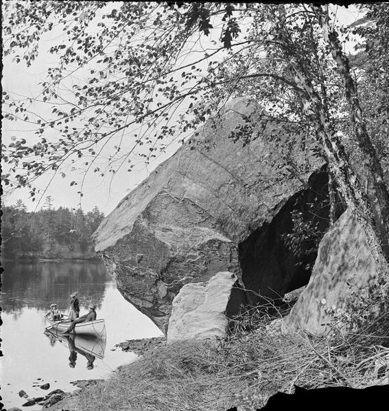 Devil's Football, near the Deep Fill. Man and two women in canoe.