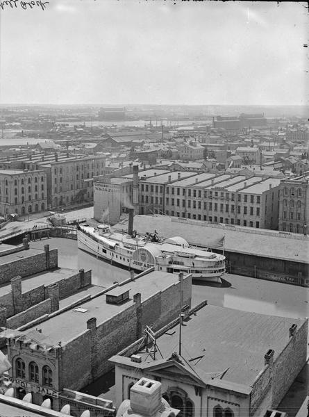 Elevated view of Milwaukee, looking southwest from Mitchell block showing buildings, and the paddle steamer <i>John A. Dix</i>.