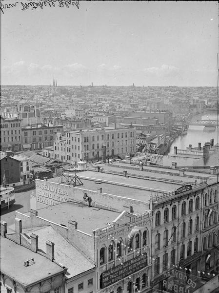 Milwaukee, northwest from Mitchell block. Elevated view of rooftops and buildings with River in background.