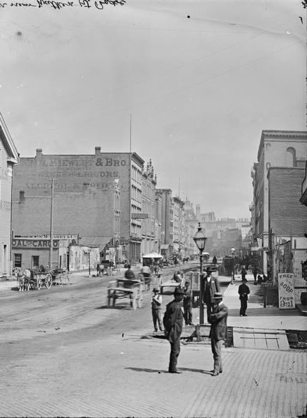 East Water Street from near Walker's Point Bridge showing two men in the foreground.