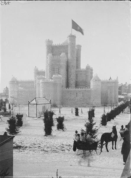 St. Paul Ice Carnival, view of ice palace. Chamber of Commerce tent in front advertises St. Paul as the geographic center of the continent. Horse-drawn sleigh on the right.