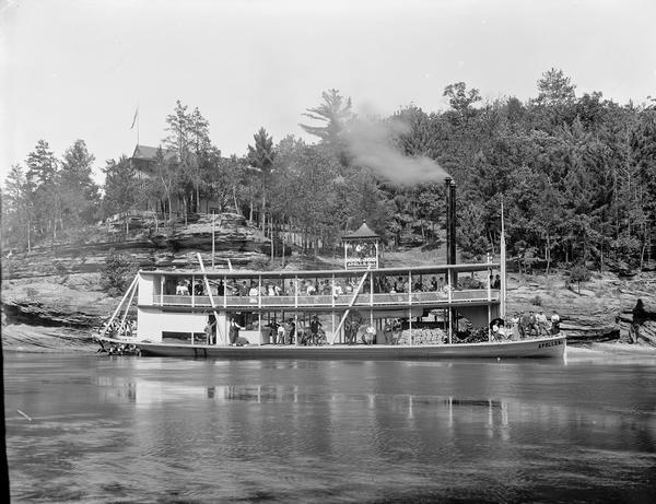 "Apollo No. 1" steamboat at landing of Larks Hotel.