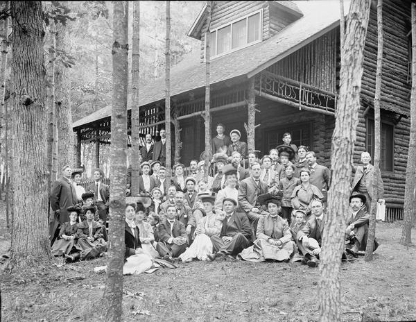 Unidentified group of people posing in front of the Bird's Nest Resort.