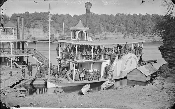 View from shoreline of the steamboat <i>Alexander Mitchell</i> and passengers.