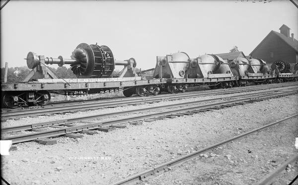 Construction equipment for Kilbourn dam loaded on trains.