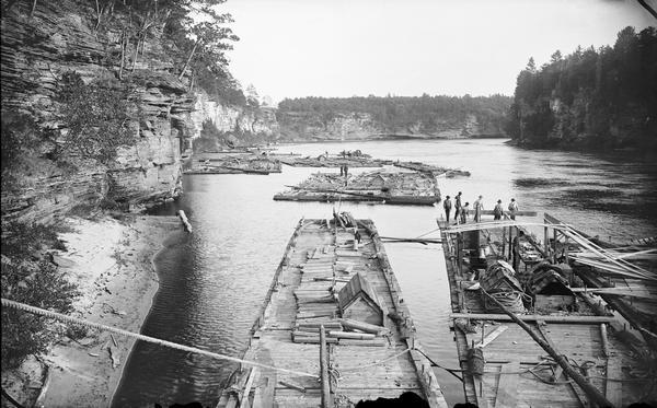 A fleet of rafts on the Wisconsin River below the Kilbourn dam.