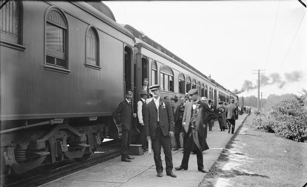 Kilbourn railroad depot, train, passengers and crew.