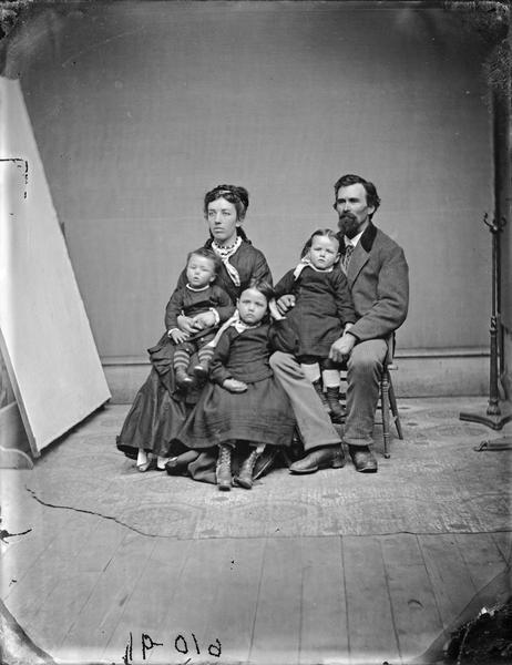 Studio portrait of Leroy Gates and family.