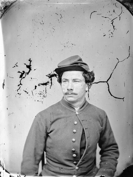 Studio portrait of H.H. Bennett in uniform.