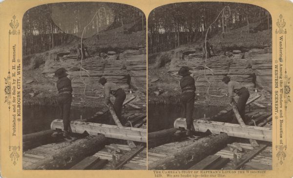 Two men on a raft that is breaking up are throwing a rope to a man standing on rocks on the riverbank.