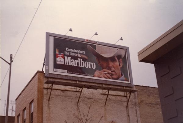 A Marlboro cigarette billboard advertisement looms over King Street.