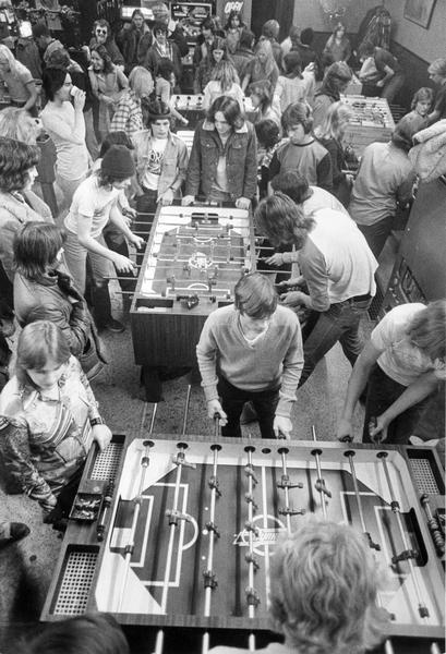 Elevated view of young people playing foosball in The Game Room, a former pizza restaurant, owned by Rosemary Mantekas at 2655 S. Kinnickinnic Avenue.