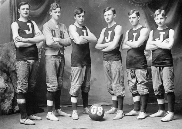 Basketball team poses for a group portrait.