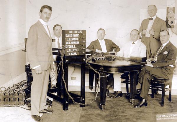 Inventor, B.L. Boboroff, displays his vote recording device to members of the U.S. House of Representatives.