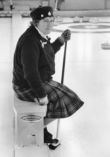 Elderly woman taking a break from a curling. She is a member of the "curling Scots" who toured the United States in 1963.