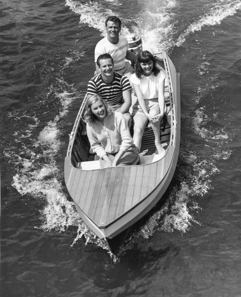 Elevated view of a group of two couples boating.
