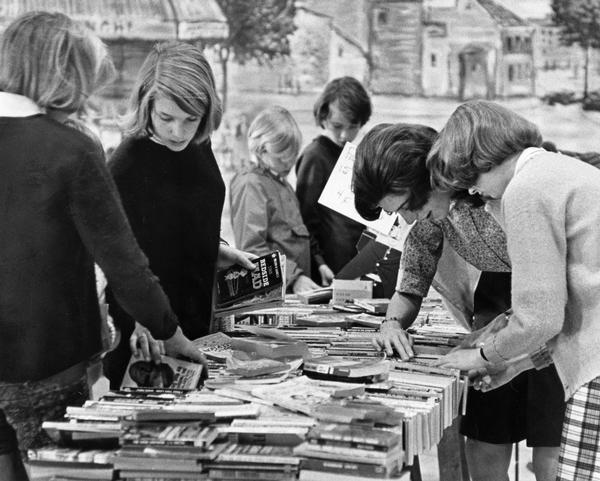 A book sale is held by the Mothers Association of Milwaukee-Downer Seminary.