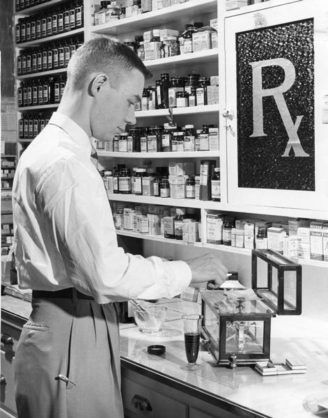 A pharmacist working in the lab area of a pharmacy.