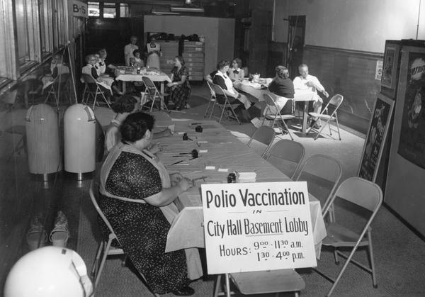 Tables are set up at a City Hall basement lobby as a venue for public access to the polio vaccine.