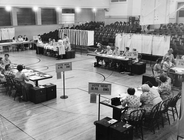 Elevated view of a gymnasium that has been converted into a place where citizens can vote on election day.