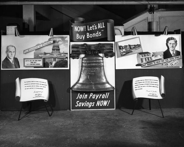 Display that advertises the sale of U.S. Savings Bonds through the Payroll Savings Plan or the Bond-a-Month-Plan. Wisconsin State Governor Walter J. Kohler, Jr., and the Mayor of Milwaukee Frank P. Zeidler are depicted on posters with personal quotes below supporting the effort.