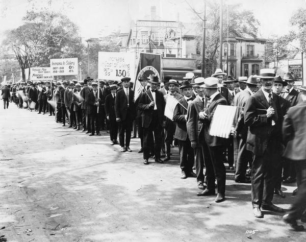 View down long line of workers from the United States Postal Service demonstrating for an increase in salary to meet war-time cost of living increases.