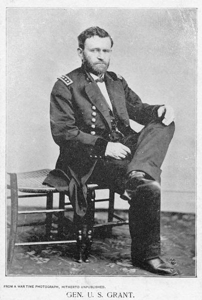 Civil War portrait of Ulysses S. Grant seated wearing a military uniform.